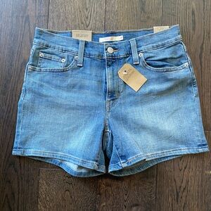 Levi’s mid length denim shorts, size 28, brand new with tags.